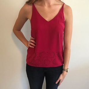 Pink top with floral cutouts. Size small